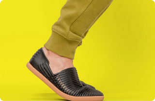 black shoes on yellow background